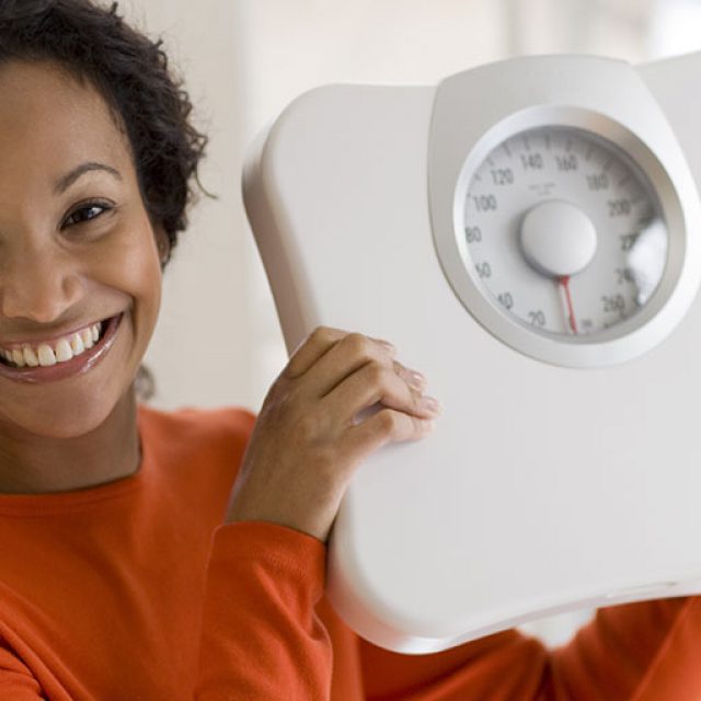 a woman getting over her weight loss plateau