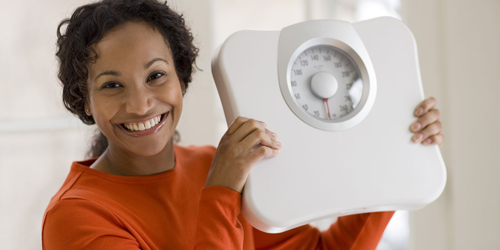 a woman getting over her weight loss plateau