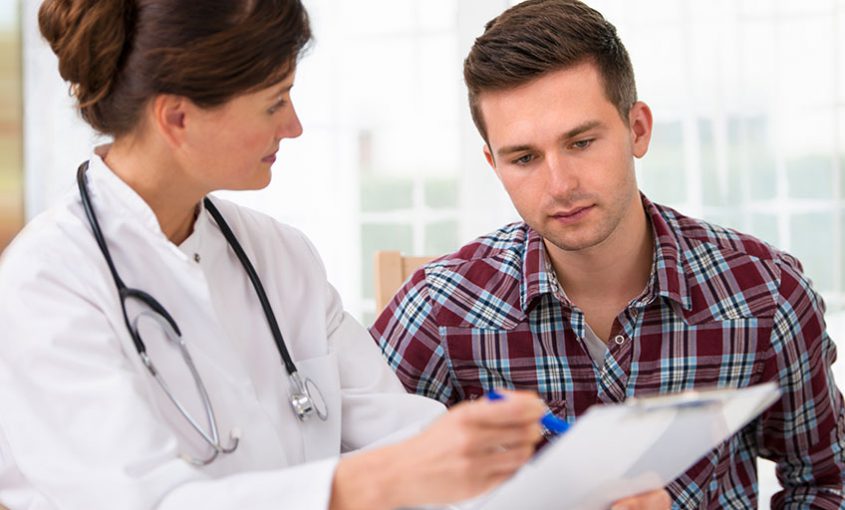 a doctor giving a patient std testing results
