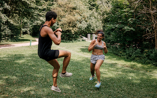 Friends do sports in a park in Munich